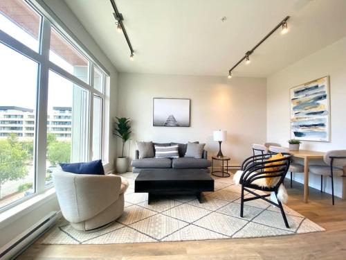 a living room with a couch and a chair at Lovely Brand New Suite in Sidney