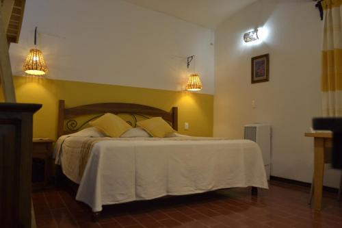 Postel nebo postele na pokoji v ubytování ¡Hermosa Estancia Centro de Oaxaca!