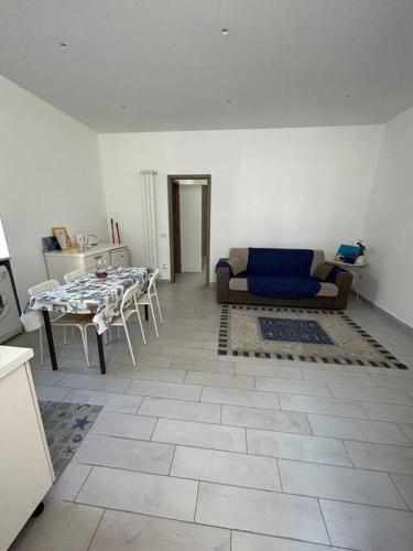 a living room with a couch and a table at casa Vesuvio in Cercola