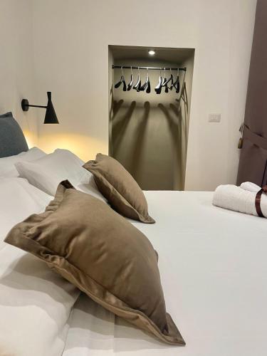 a bedroom with a bed with pillows on it at Summertime in Bisceglie