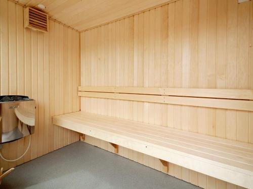 a sauna with a wooden bench in a room at Seaside Bliss in Nysted - By Traum Ferienwohnungen in Nysted