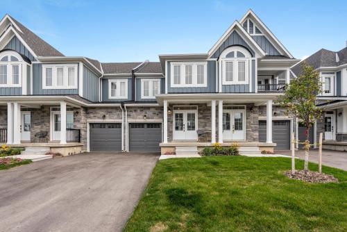 a large house with a driveway at Jewel of Blue Mountain - Walk to Ski and Village - EV plug in Blue Mountains