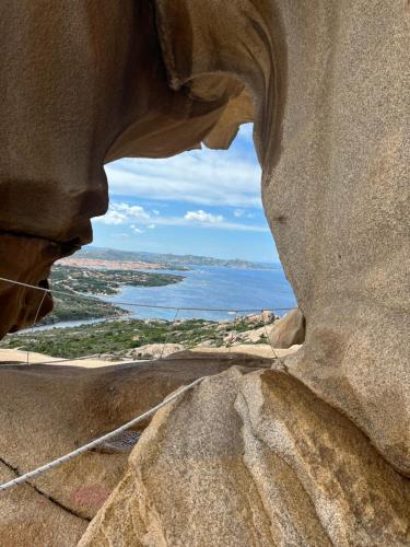 a view of the ocean from a rock formation at Stazzo La Foci soluzioni vista Mare in Aglientu