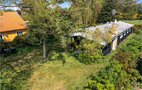 an aerial view of a house with a yard at Pet Friendly Home In Samsø With Kitchen in Ballen