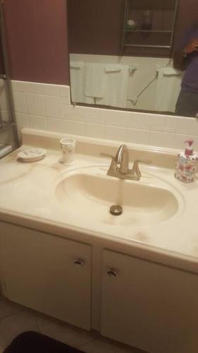 a bathroom with a sink and a mirror at Cozy, cute beach condo in Westerly RI . Best value in Westerly!! in Westerly