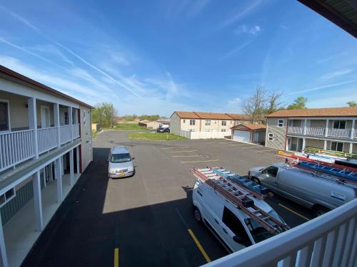 a car parked in a parking lot next to a building at Stay Inn and Suites in Niagara Falls
