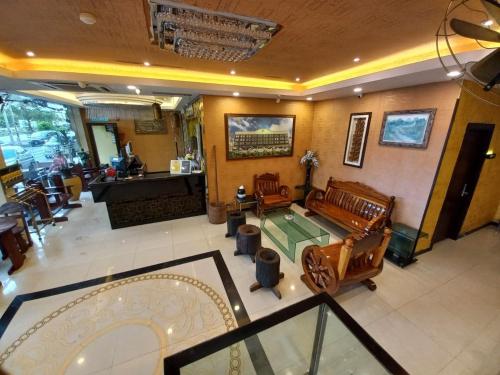 an overhead view of a living room with a table and chairs at GM Hotel in Changlun
