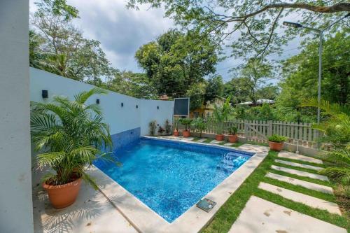 a swimming pool in the backyard of a house at Cozy Beach Villa at The Shores 5 minutes from the beach in West End