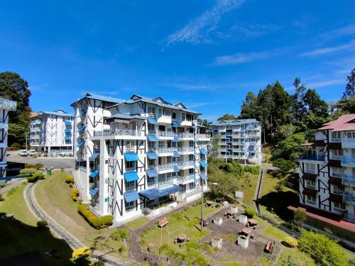 an aerial view of a building in a city at MERLIN HOME DESA ANTHURIUM in Tanah Rata