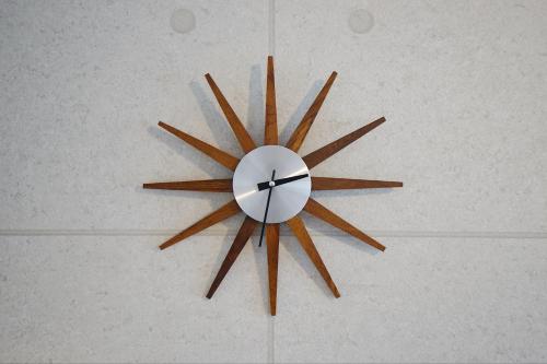 a clock hanging on a wall with at 川HOUSE黒門 in Osaka