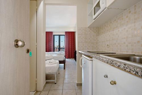 A bed or beds in a room at Paradise Zante Standard Studio 2