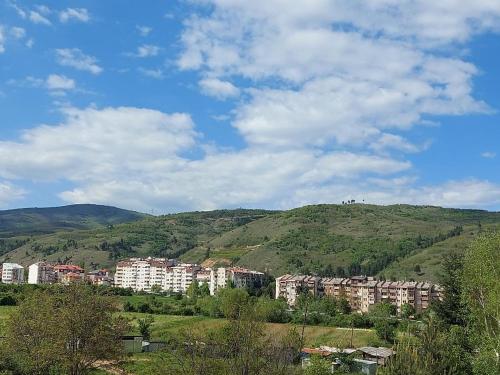 een groep gebouwen bovenop een heuvel bij Jove Apartments in Bitola