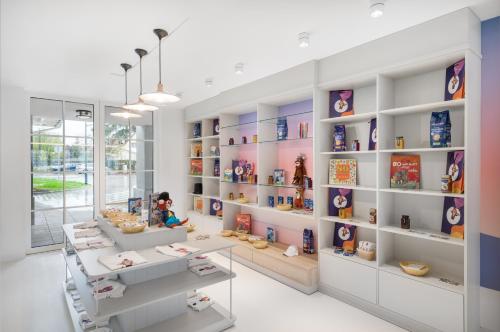 a childrens store with a lot of shelves with toys at Mövenpick Balaland Resort Lake Balaton in Szántód
