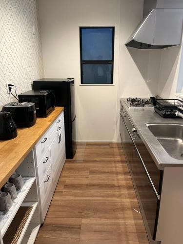 Η κουζίνα ή μικρή κουζίνα στο Nao's House USJ 3 New open 一軒家貸切
