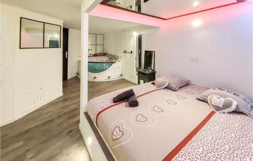 a bedroom with a large bed and a swimming pool at Gorgeous Apartment In Saint-Bonnet-Le-Châtea in Saint-Bonnet-le-Château