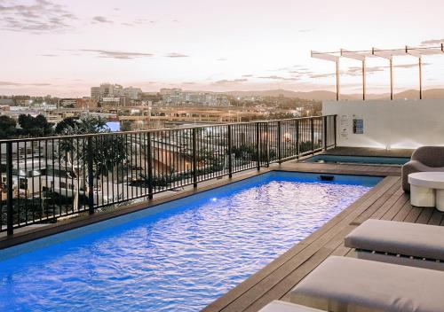 a swimming pool on the roof of a building at Rambla at Perry House in Brisbane