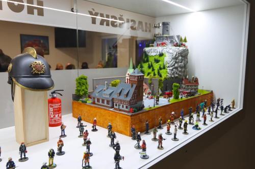 a group of miniature figurines of a building on a table at Hasičský hotel Přibyslav in Přibyslav