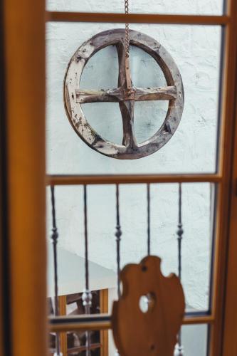a peace sign hanging from a window at Hotel Schmuckhof in Chiusa
