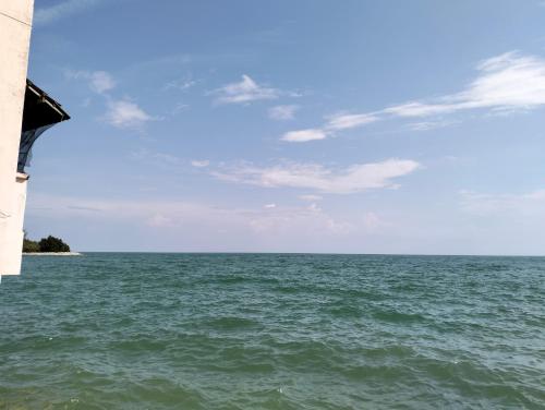 a view of the ocean from a beach at Paradise Seaview Homestay in Port Dickson