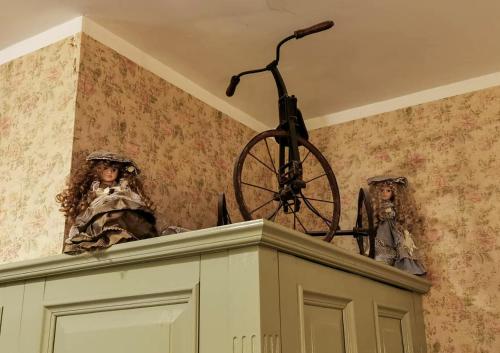 a bike on top of a cabinet with a wheel on top at Laitse castle in Laitse