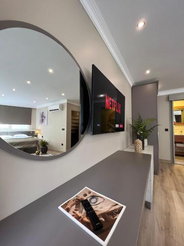 a large mirror on a wall in a living room at The House Company in Istanbul