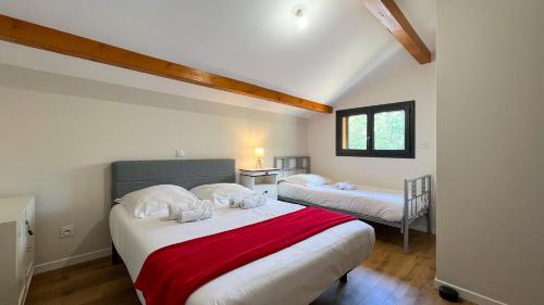 a bedroom with two beds in a attic at Chalet Anthony in Faucon-de-Barcelonnette
