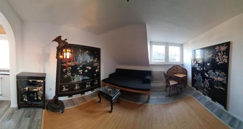 a living room with a couch and a table at Gästehaus Fuchsröhre in Welcherath