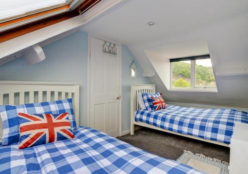 En eller flere senge i et værelse på Seals Cottage