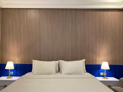Postel nebo postele na pokoji v ubytování Madina Inn Hotel
