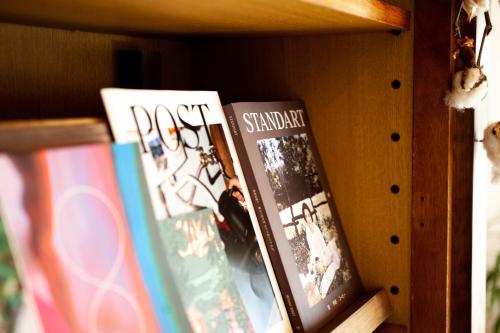 three books are sitting on a shelf at 長瀞NEMAKI in Nogami