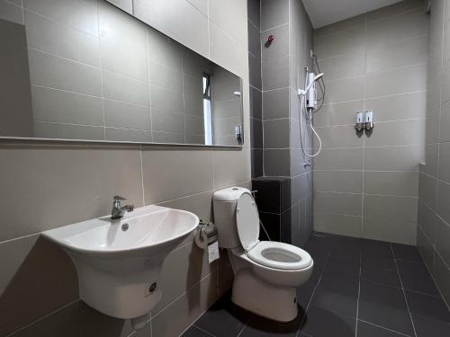 a bathroom with a toilet and a sink at Duck Duck House 3BR 7-11 PAX in Johor Bahru