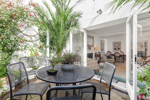 a patio with a table and chairs at Veeve - Heart of Hampstead in London