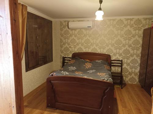 A bed or beds in a room at Shalvaseuli marani - Guesthouse