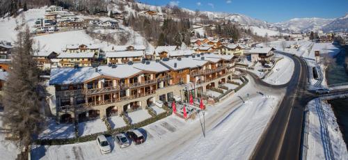 an aerial view of a resort in the snow at AvenidA Mountain Lodges Kaprun in Kaprun