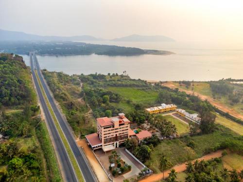 an aerial view of a building next to a road at Sterling Karwar in Kārwār