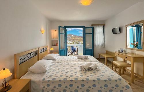 Ένα ή περισσότερα κρεβάτια σε δωμάτιο στο Horizon Hotel