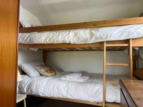 a couple of bunk beds in a room at Gors Eilian in Amlwch