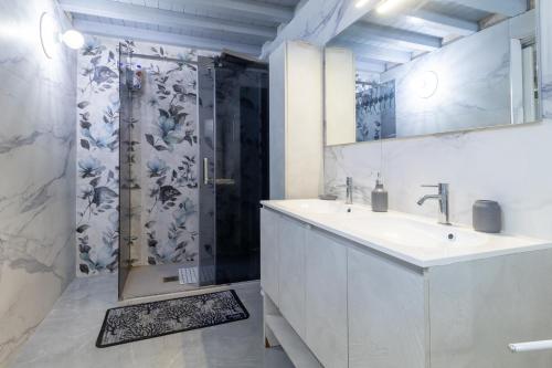 a bathroom with a shower and a sink and a showerspective at Chalet Melody in Santa Croce Camerina