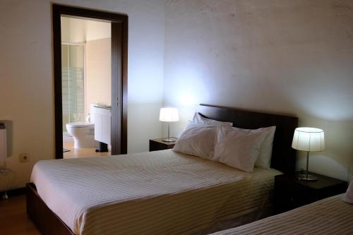 Postel nebo postele na pokoji v ubytování Alvão Village & Camping