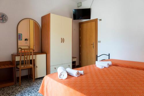 Postel nebo postele na pokoji v ubytování B&B Hotel Villa Nora