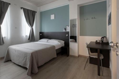 Postel nebo postele na pokoji v ubytování Il B&B di PIAZZA MOTTA