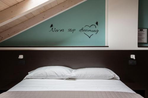 Postel nebo postele na pokoji v ubytování Il B&B di PIAZZA MOTTA