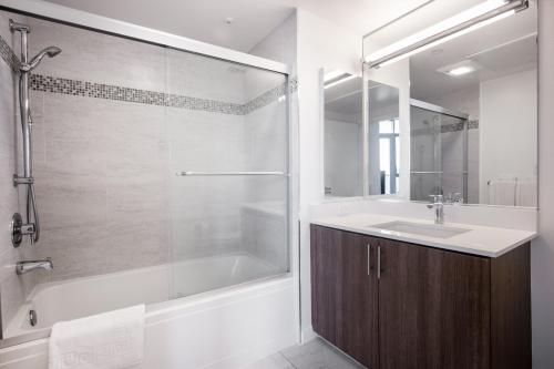 a bathroom with a tub and a sink and a shower at W Hollywood 1BR w gym rooftop nr shopping LAX-176 in Los Angeles