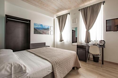 Postel nebo postele na pokoji v ubytování Il B&B di PIAZZA MOTTA