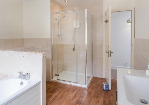 a bathroom with a shower and a sink at Greenleaf in Bamburgh