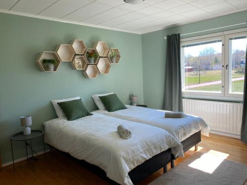 a bedroom with a large bed and a window at Villa Valentina in Lemland