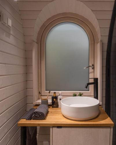 a bathroom with a sink and a large window at Igluhut Four Seasons in Pfarrwerfen