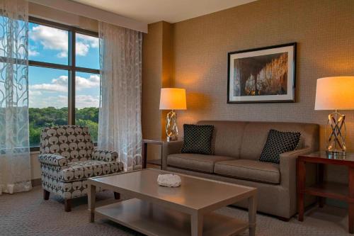 a living room with a couch and a chair at Sheraton Austin Georgetown Hotel & Conference Center in Georgetown