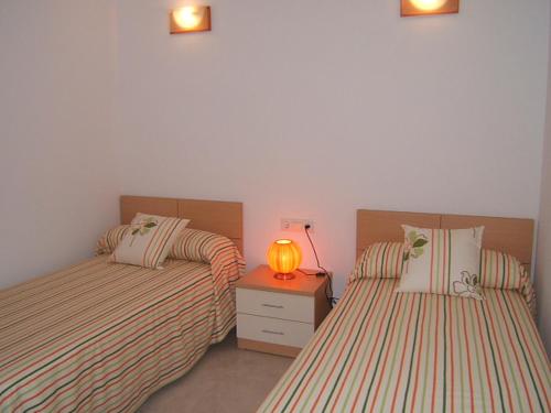 Postel nebo postele na pokoji v ubytování Villa Cala Llobeta 4C-11