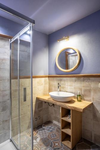 a bathroom with a sink and a shower at Fattoria Fibbiano in Terricciola